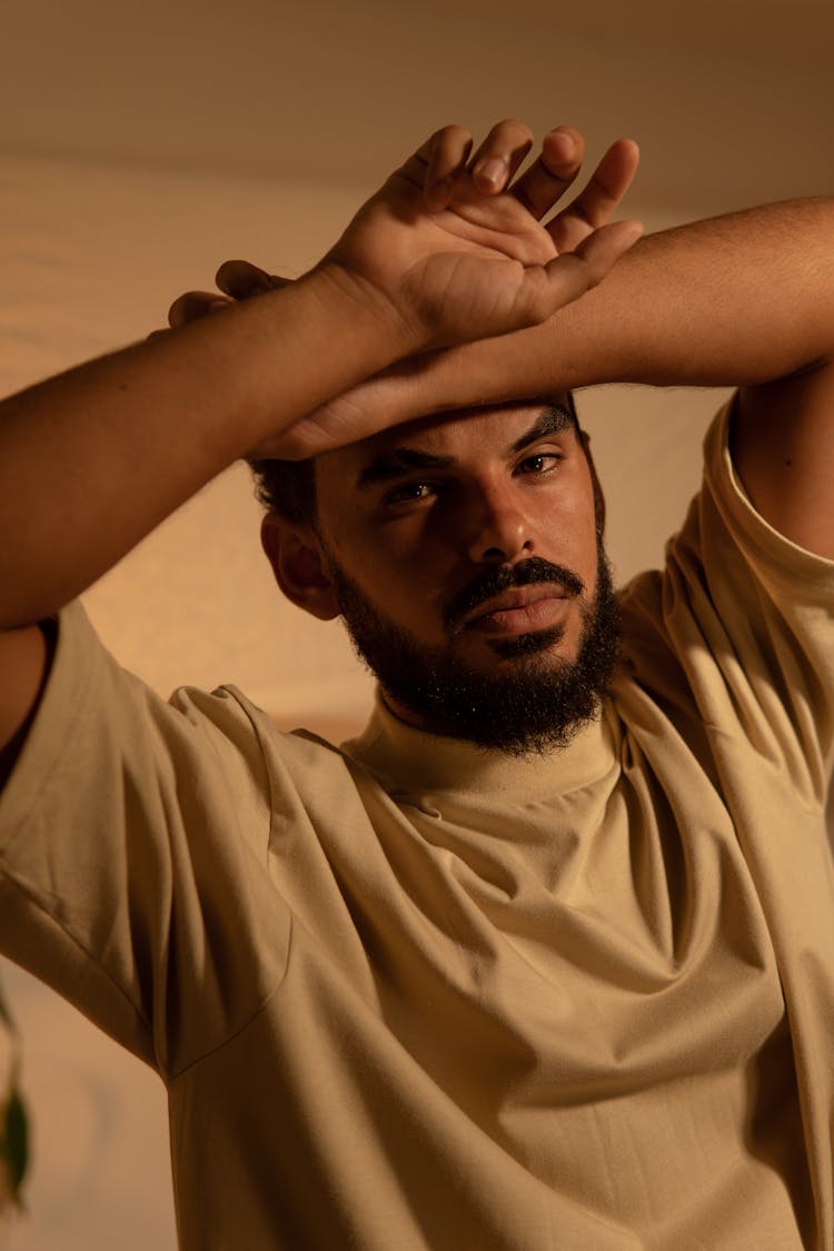 A Bearded Man In Beige Shirt