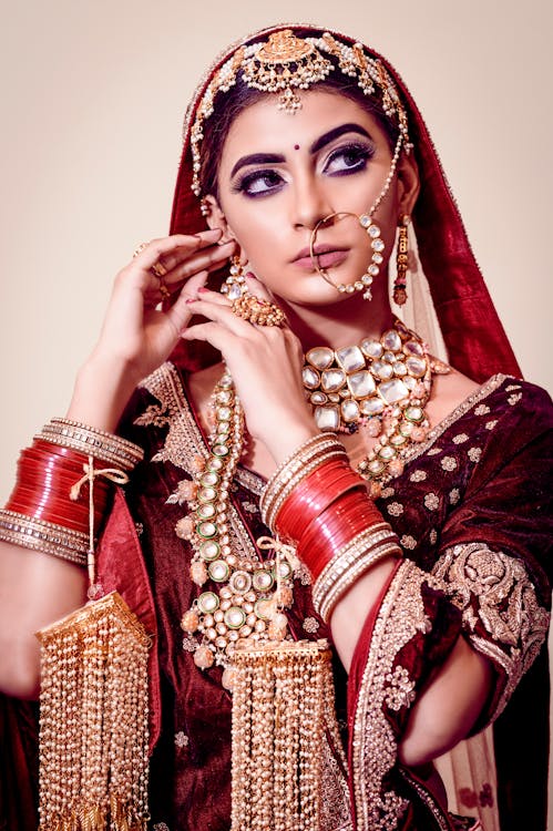 Beautiful Bride Wearing Red Sari and Accessories · Free Stock Photo