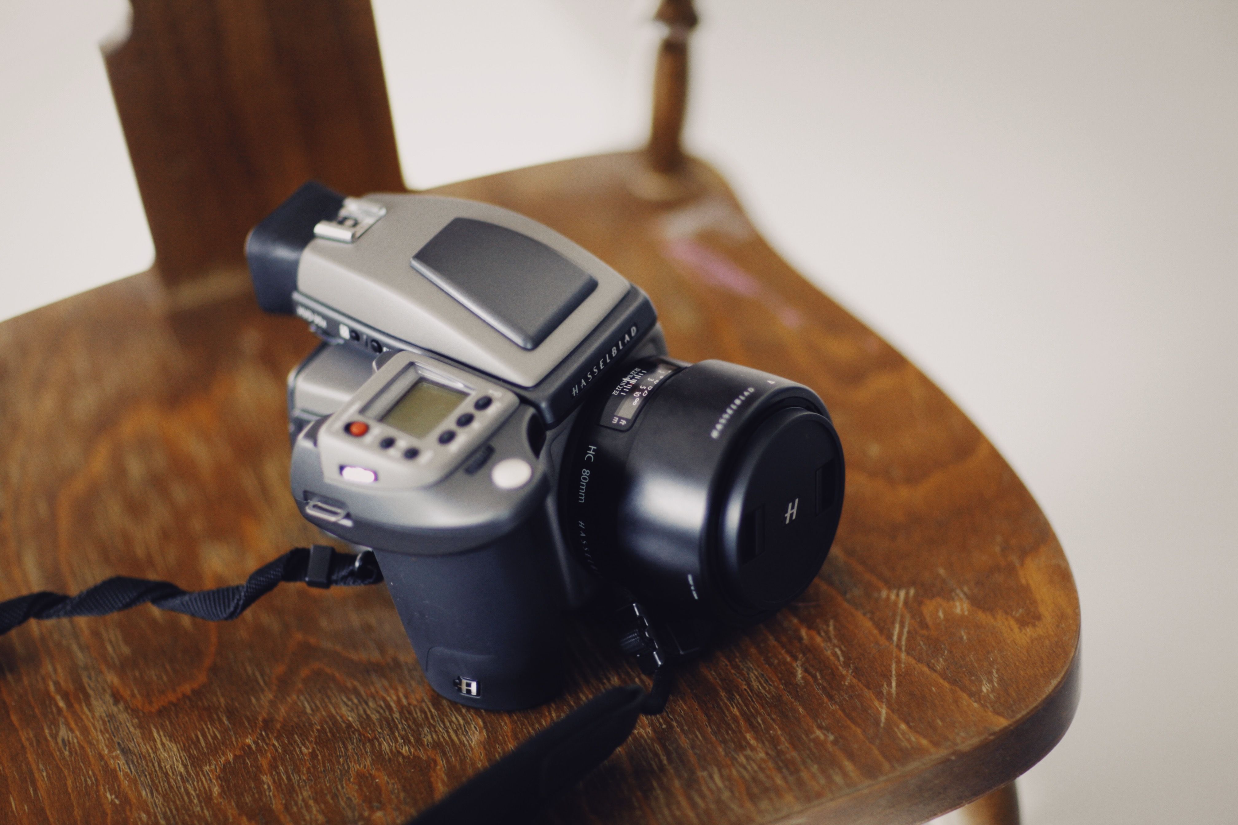 Digital Camera on a Wooden Chair · Free Stock Photo