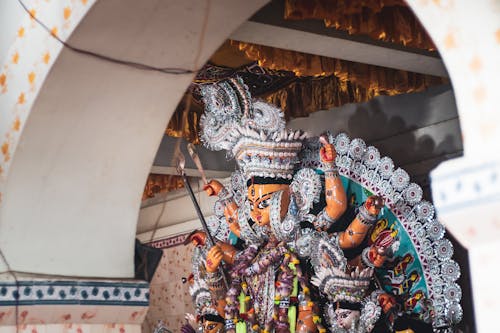 A Statue of Durga Puja with Leis