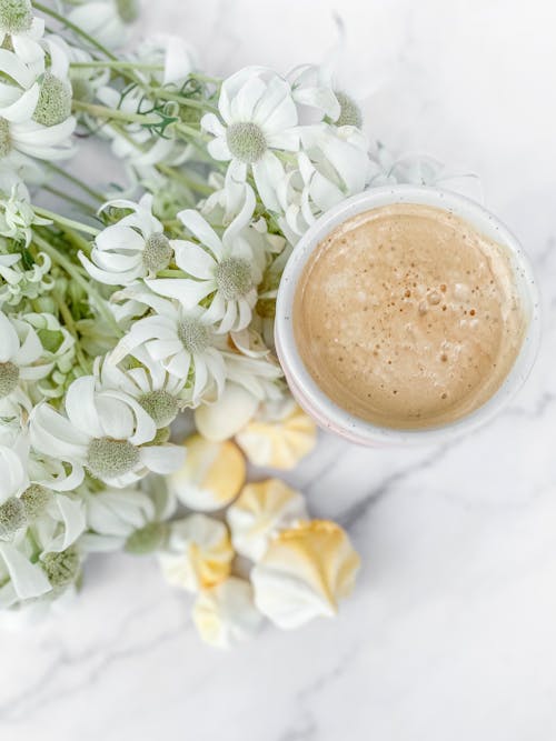 Free Bunch of Faded Flowers, Meringue and coffee Stock Photo