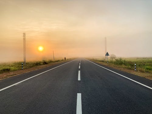 Free stock photo of asphalt road, foggy day Stock Photo