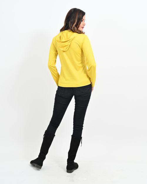 Free Full shot of a stylish woman in yellow hoodie looking over shoulder against white background. Stock Photo