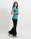 Woman in Teal Tank Top and Black Pants