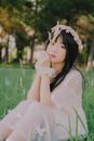 Woman Wearing White Dress Holding Pampas Grass