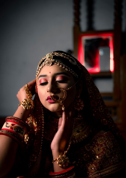 Free Stunning portrait of an Indian bride adorned in traditional jewelry and attire, exuding grace. Stock Photo