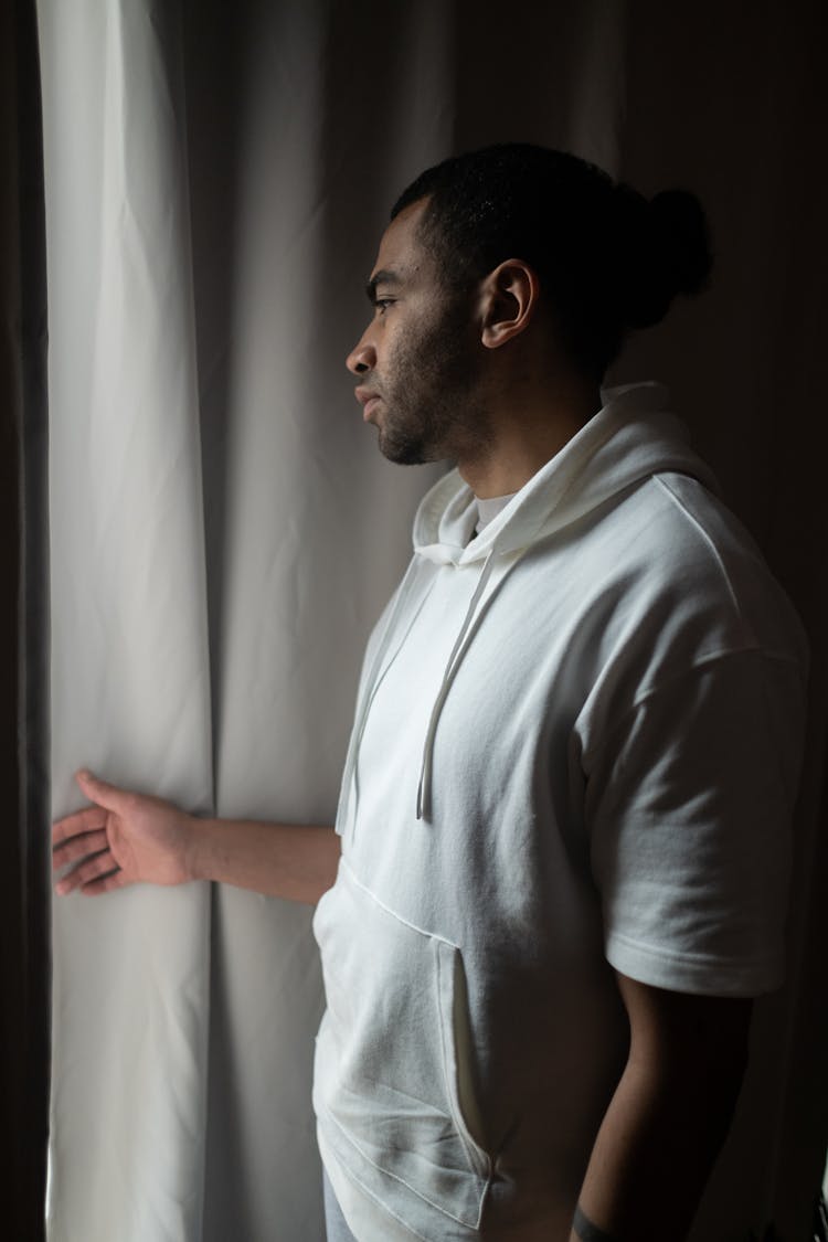 Man Looking Through Window