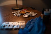 Pills and Ruber Gloves on the Table