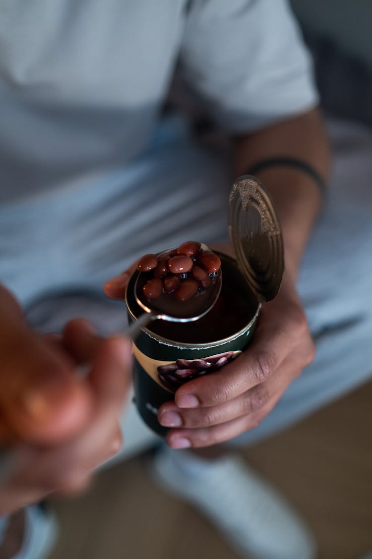 Person Holding Canned Beans 