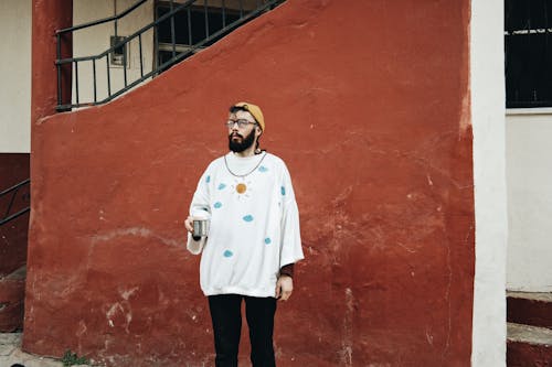 Adult Man Standing Outside With Coffee