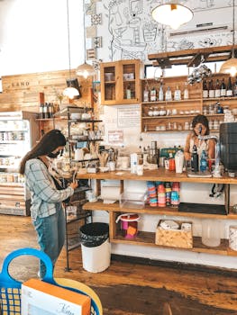 A lively coffee shop with a customer and barista interacting at the counter. Cozy and inviting atmosphere.
