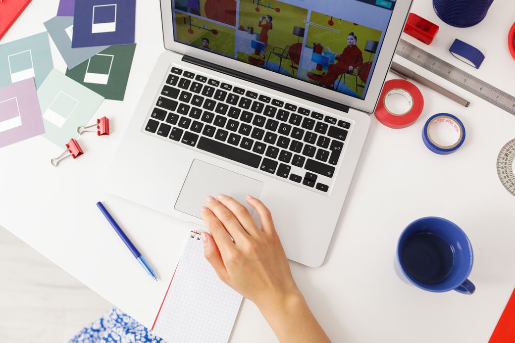An overhead view of a laptop showing a colourful layout in progress, photo by Ron Lach on Pexels