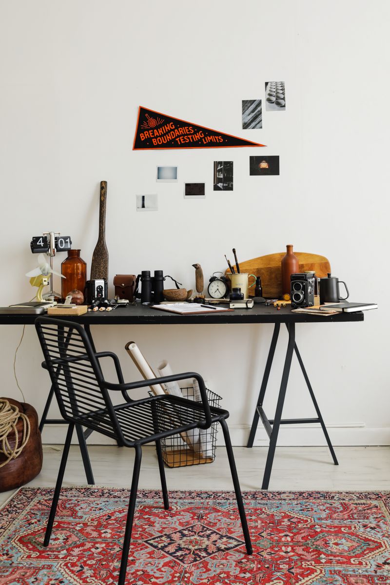 Stylish home office with decor and organized accessories on a black desk