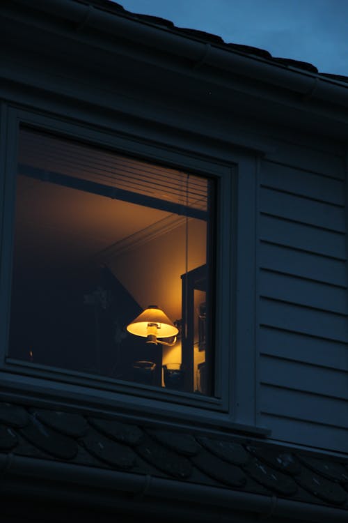Free Lighted Lamp on a House  Stock Photo