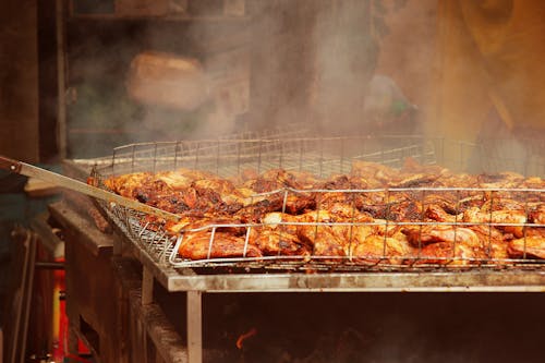 Free Grilled Meat on Stainless Steel Tray Stock Photo