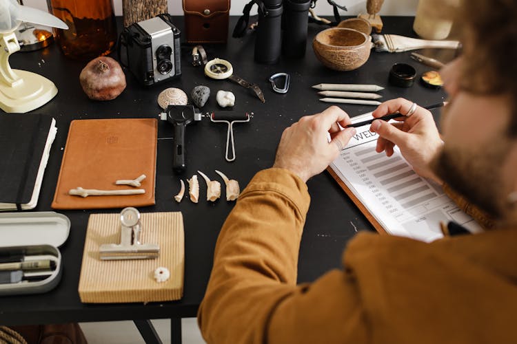 Archeologist Conducting A Study Of Fossils 