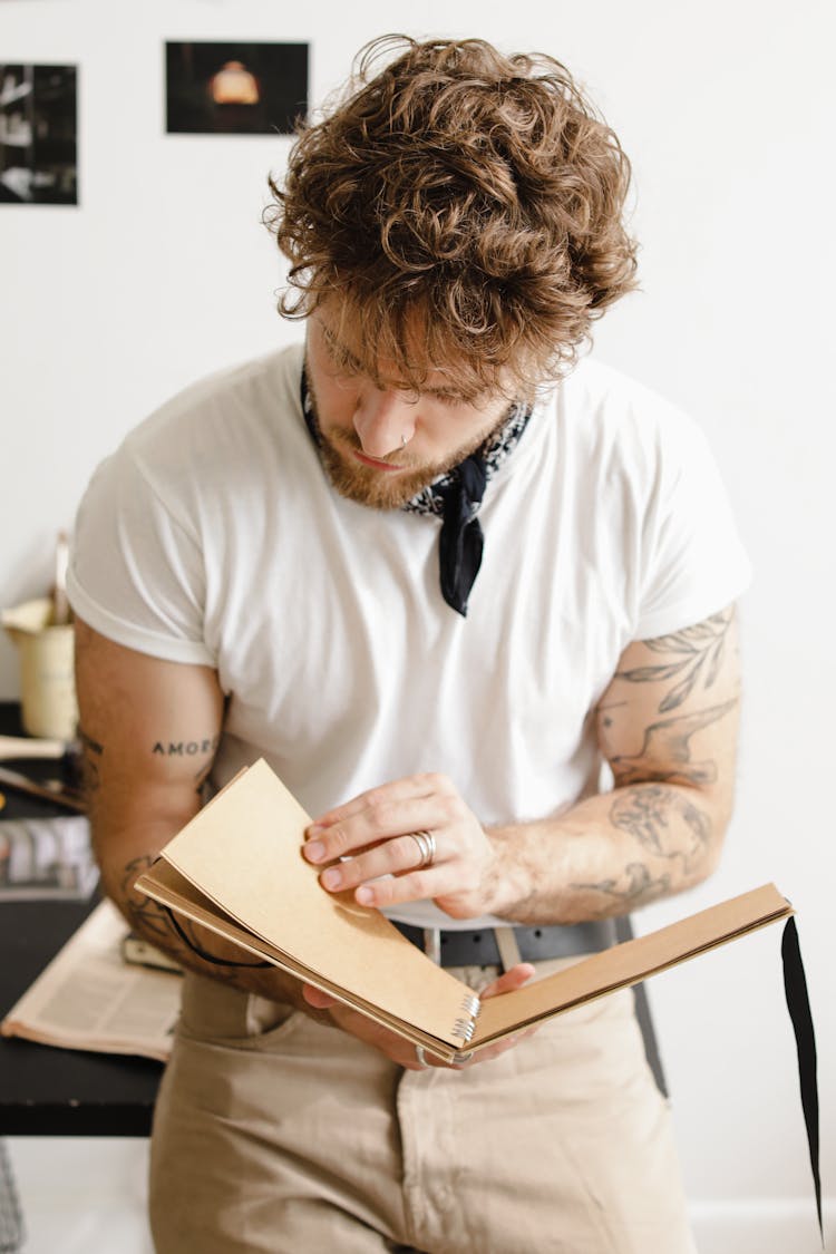 Man Reading A Journal 