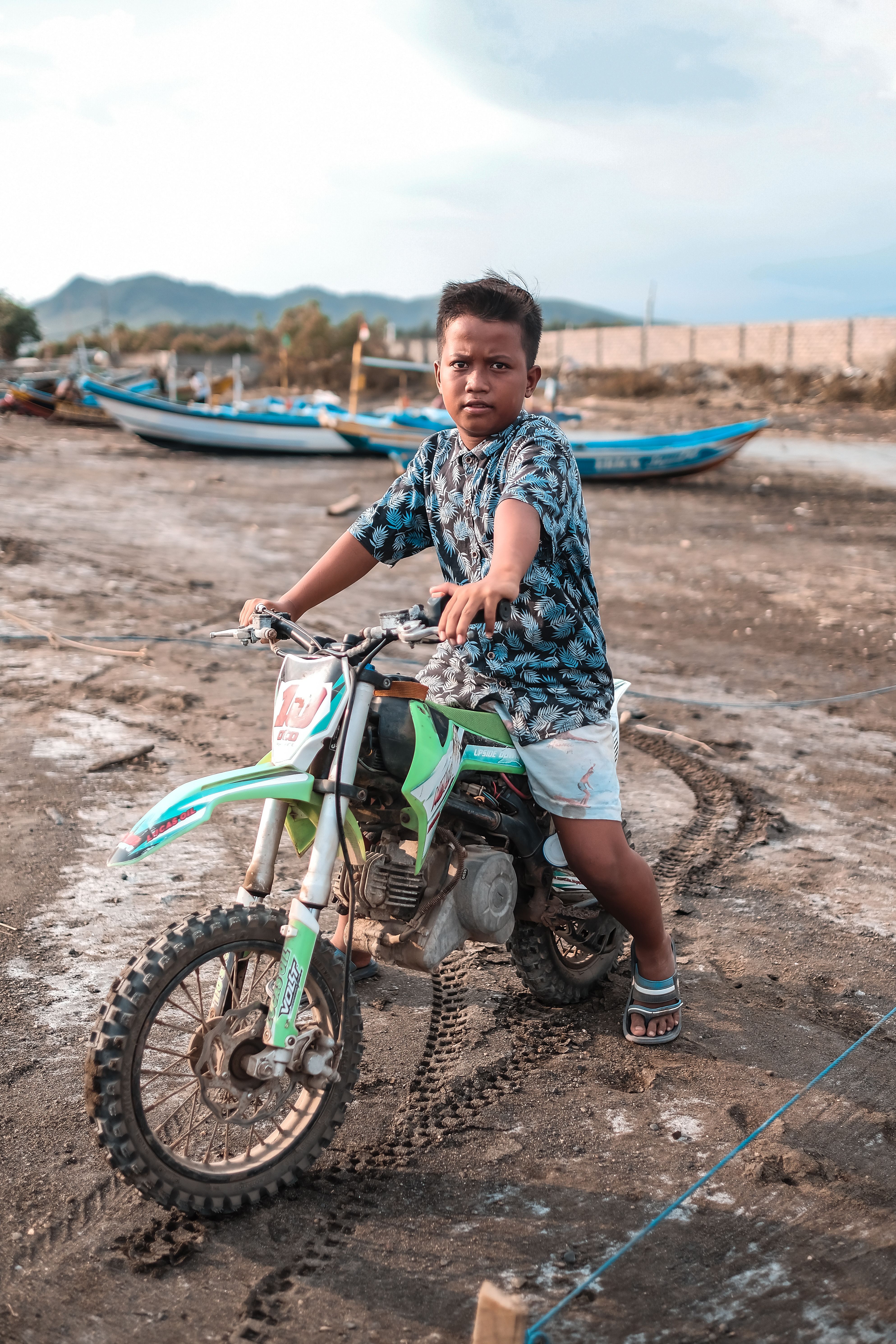 A Boy Riding a Motorcycle · Free Stock Photo