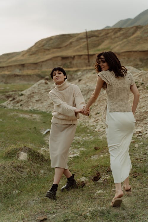 Fashion Models Wearing Neutral Colour Clothing, Posing in a Barren
