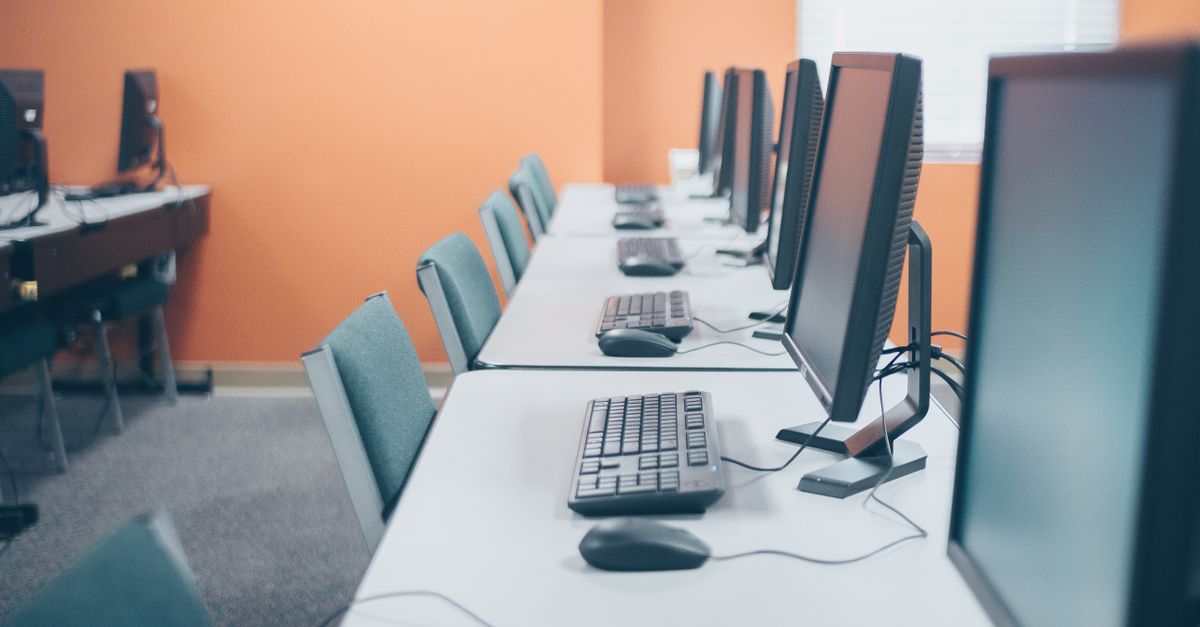 Computer Office Real Photo Modern office with desktop computers and keyboards · Free Stock Photo