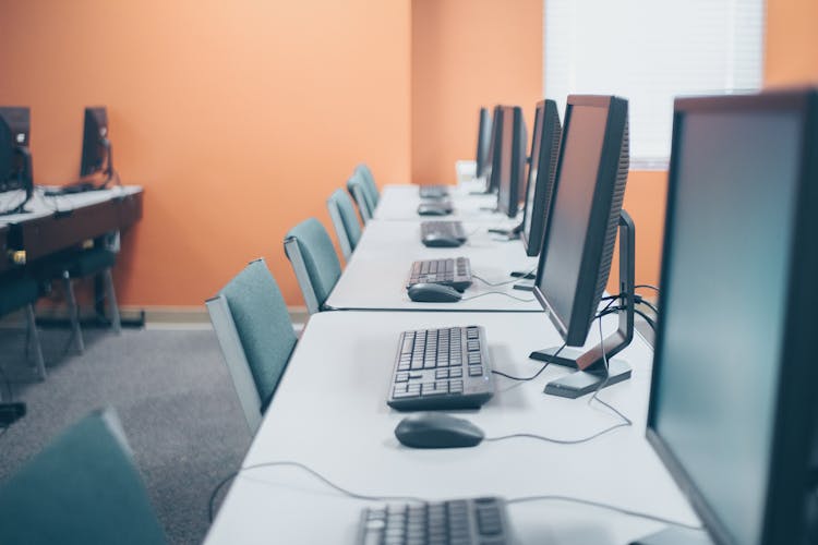 Modern Office With Desktop Computers And Keyboards