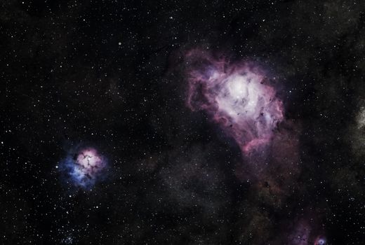 Capture the beauty of space with this clear image of a vibrant nebula surrounded by stars. Perfect as a wallpaper.