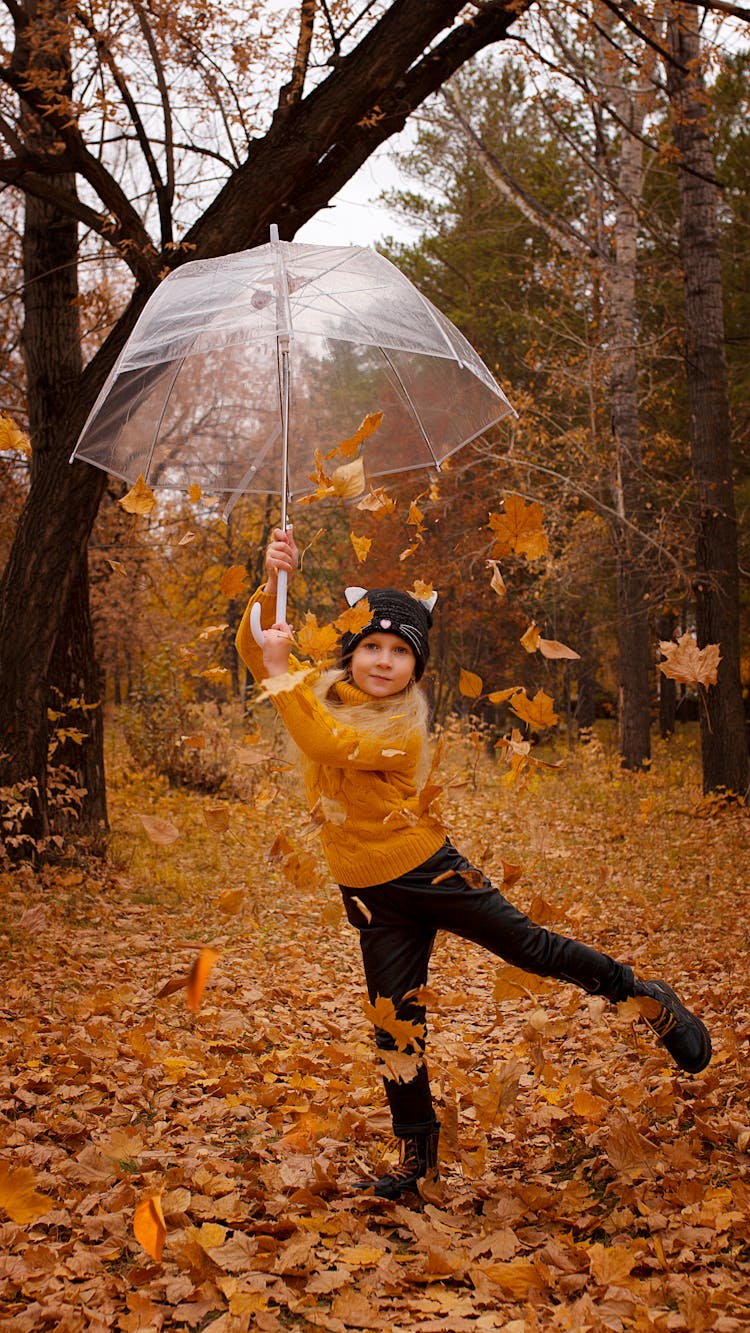 A Girl Holding An Umbrella