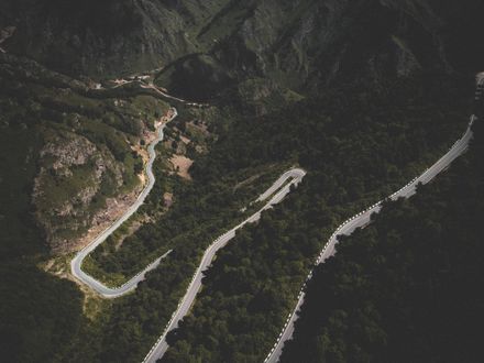 Aerial view of a switchback mountain road — Roman Kirienko on Pexels