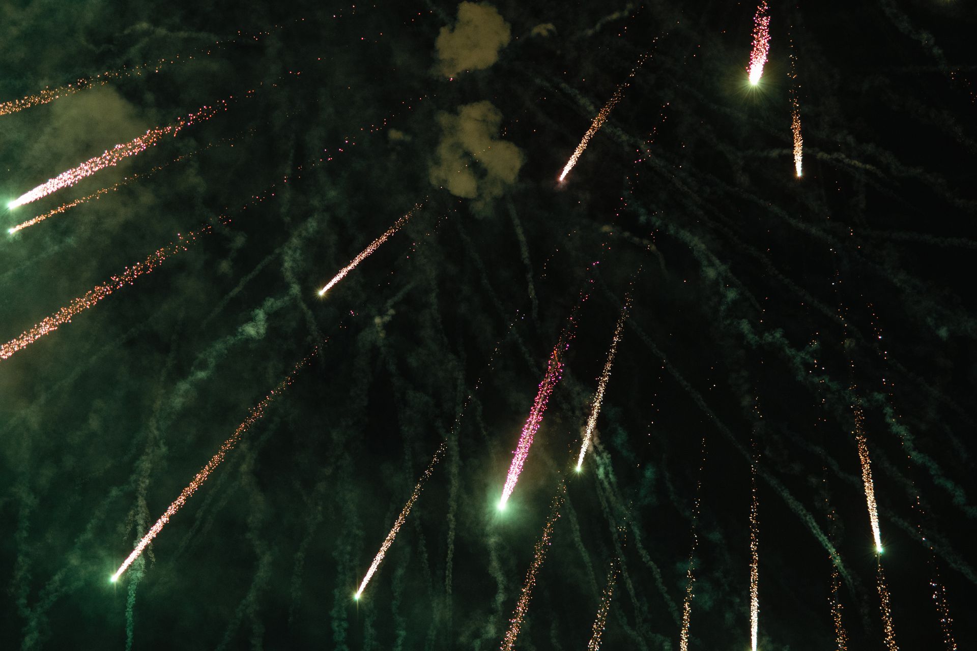 Stunning fireworks burst across the dark night sky, ideal for celebration themes.
