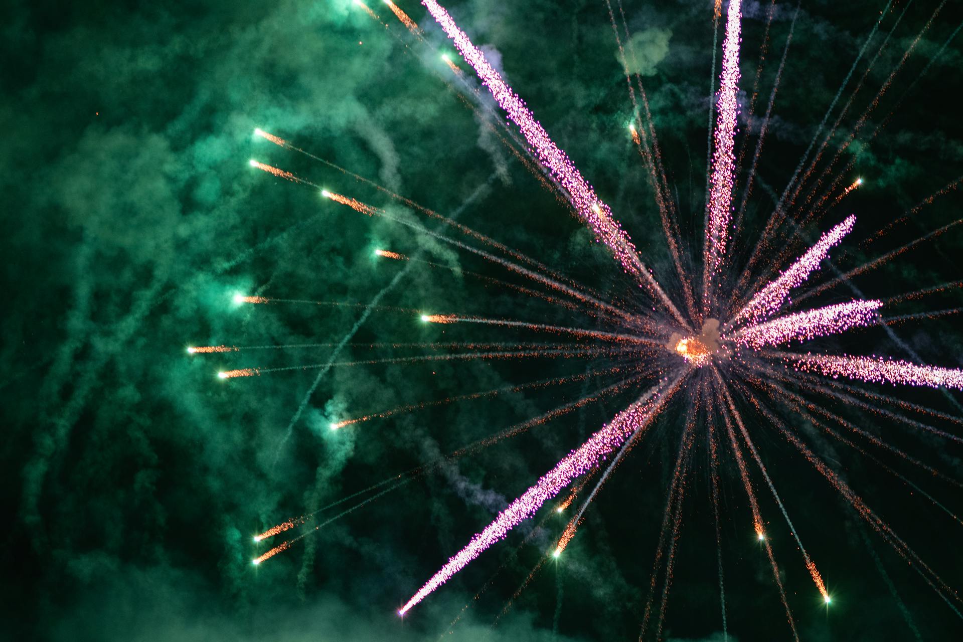 Pink and Green Fireworks Exploding