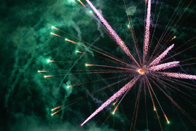 Pink And Green Fireworks Exploding