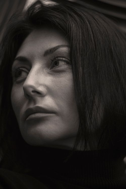 Free A captivating black and white close-up portrait of a thoughtful woman, captured in Lviv. Stock Photo