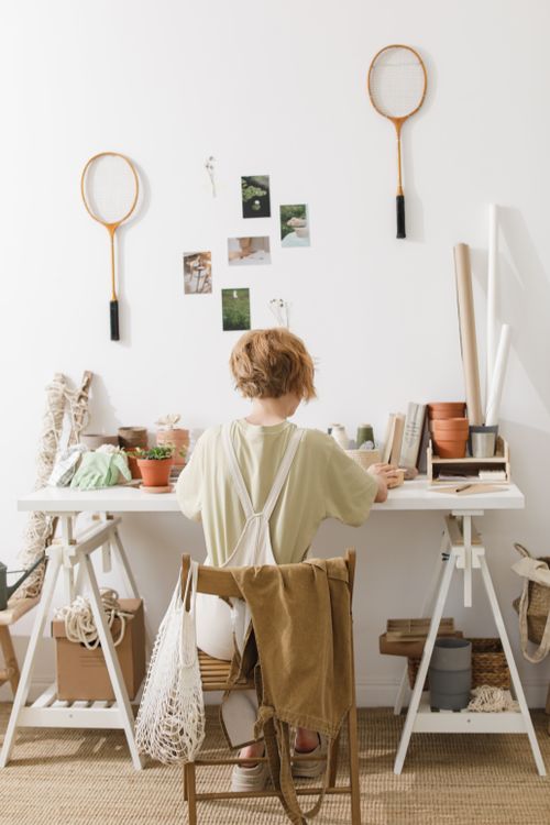 Free A serene home office with plants, books, and DIY decor in a minimalist style. Stock Photo