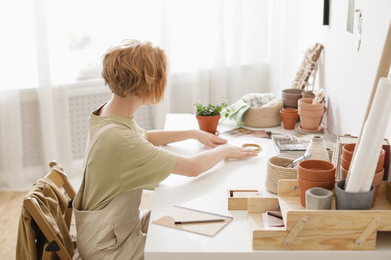 desktop riser converter on a wooden desk