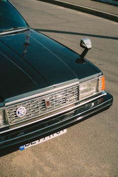 Detailed shot of a classic car front grille showcasing vintage and retro design elements.