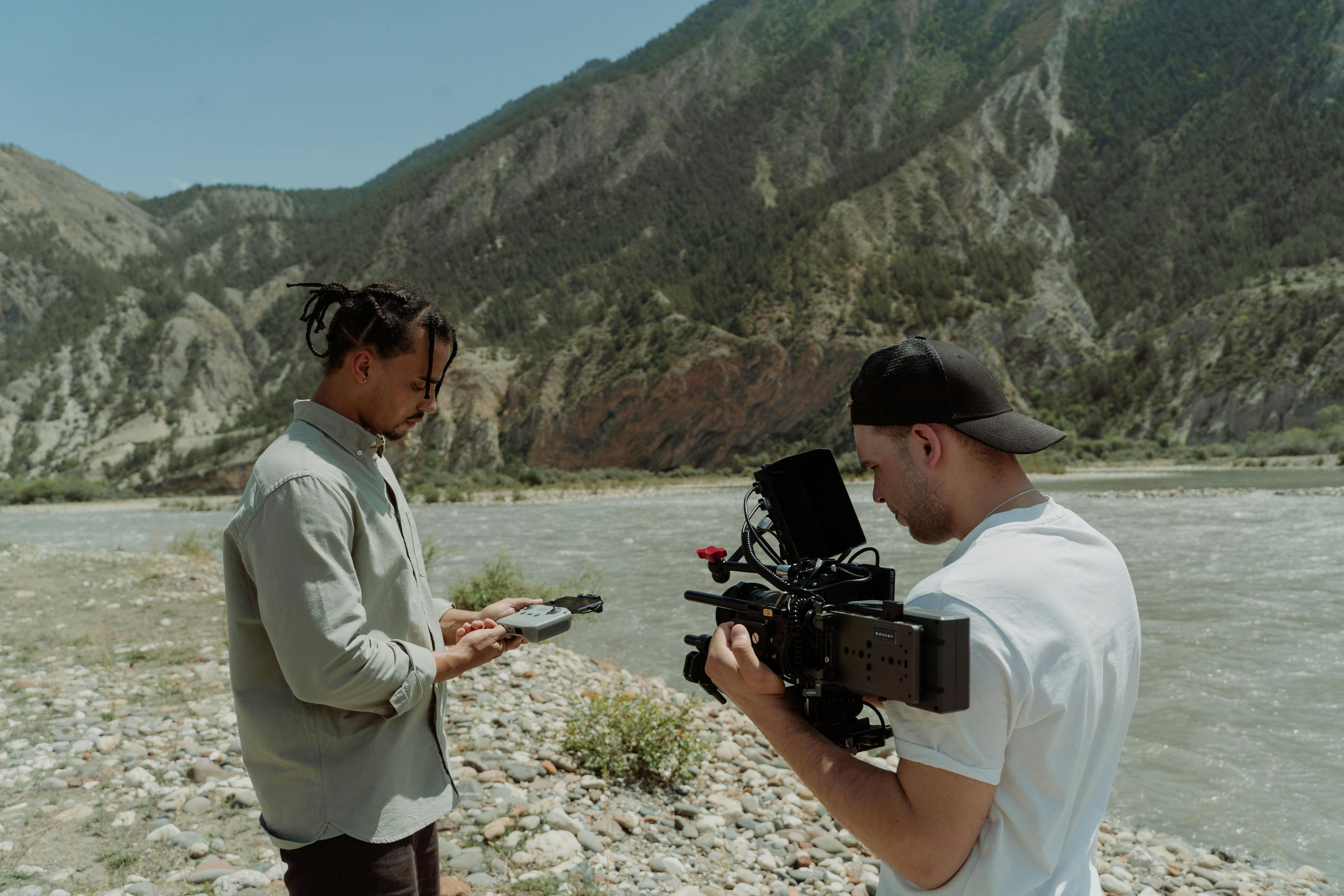 camera man and an actor beside a lake