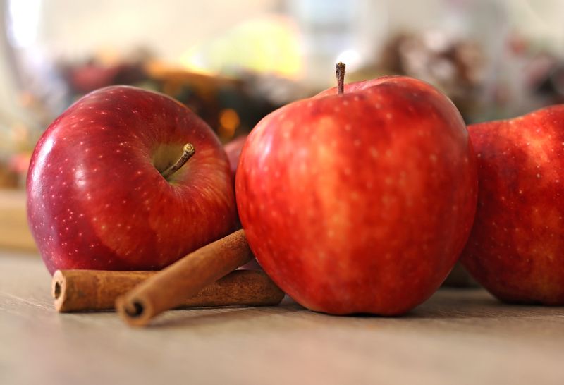 Red apples and cinnamon sticks for apple cinnamon overnight oats without yogurt