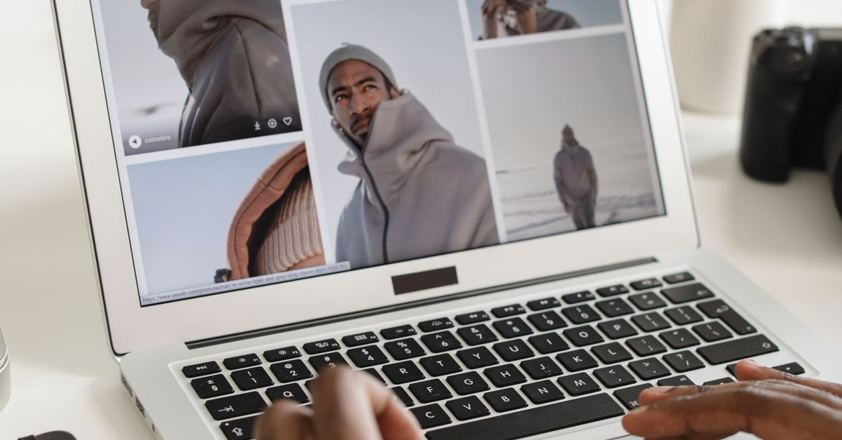 Browsing Computer Picture A Person Browsing Photos on a Laptop · Free Stock Photo