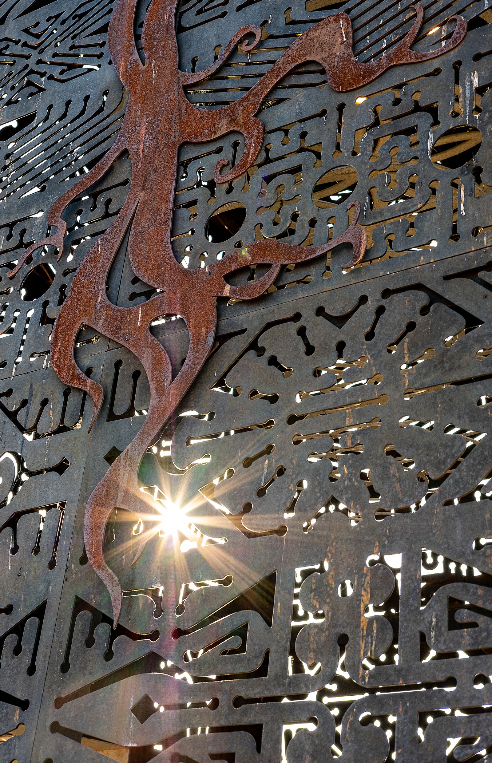 Laser-cut steel panel with a detailed pattern