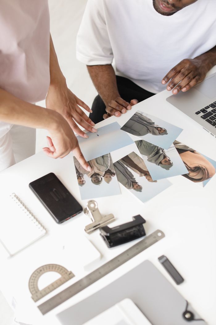Two creative professionals reviewing a project in a workspace — photo by Ron Lach on Pexels