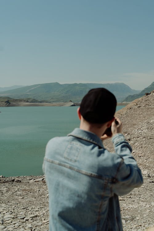 Back View of a Man Wearing a Denim Jacket