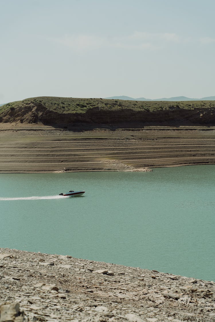 Motorboat Traveling Across A Lake