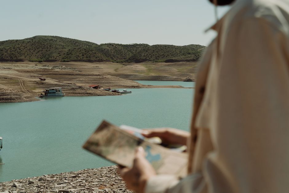 Traveler consulting an offline map in the remote Siwa Oasis, Egypt