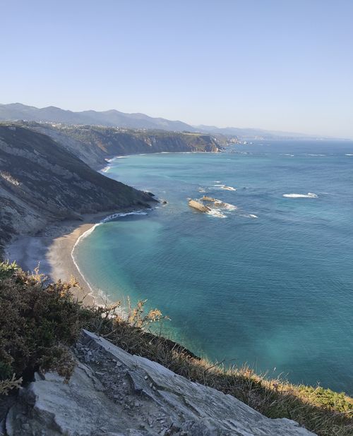 Free Breathtaking view of a coastal scene with cliffs and turquoise waters. Stock Photo