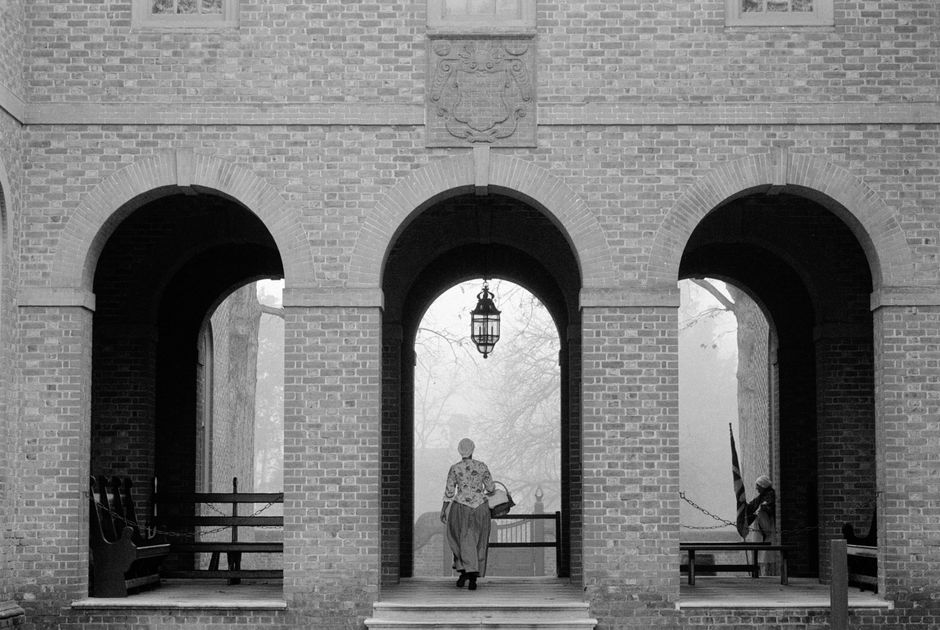 Monochrome photo of colonial arched entrance in Williamsburg, Virginia.