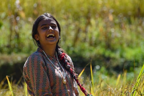 Free Woman in Printed Shirt Smiling Stock Photo