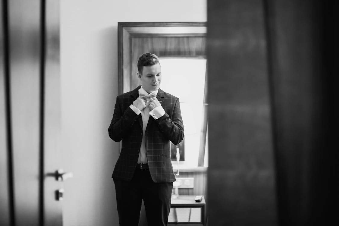 Grayscale Photography of a Man in Formal Suit Jacket