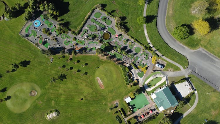 Aerial Shot Of A Huge House With Grass Field