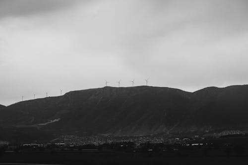 Grayscale Photo of a Mountain under the Sky