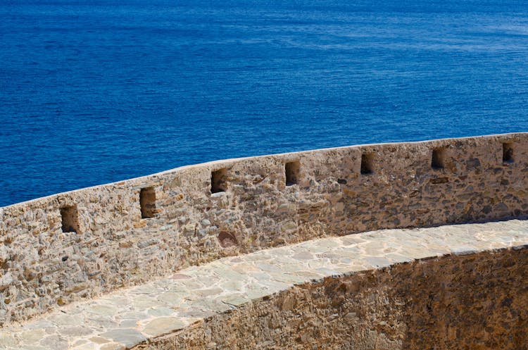 A Stone Wall By A Sea